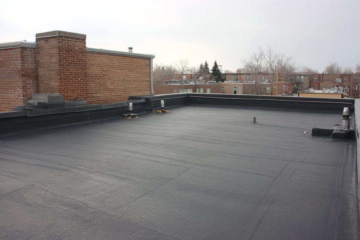Finished two-ply modified bitumen flat roof on a Jackson Heights co-op building